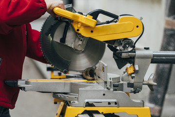 Worker using a cut machine