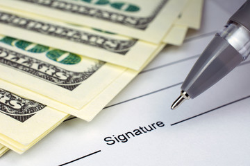 put a signature on an contract waiting to be signed money dollars