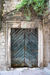 old wooden green doors in Montenegro in Kotor