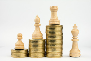 wooden chess white king, bishop, castle, pawn stairs piles of gold coins isolated on white background