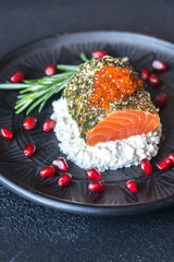 Salmon in mint sauce with red caviar and ricotta