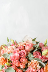 Flower composition on a gray background. Wedding and Festive decor. Powdery pink color. copy space. closeup
