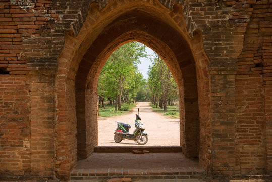 Electric bike parked by temple in Bagan, Myanmar
