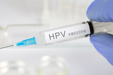 Vaccination healthcare concept. Hands of doctor or nurse in medical gloves with medical syringe...