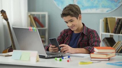 Boy enthusiastically chatting online with girl he likes, first love feelings