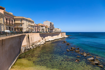 Fototapeta na wymiar Syracuse, Italy. Quay on the island of Ortygia, ancient shore fortifications