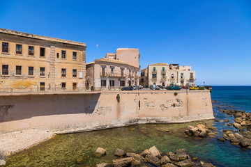 Fototapeta premium Syracuse, Italy. Embankment on the island of Ortygia, an ancient fortress wall