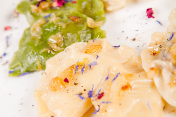 Dumplings with different kinds of stuffing decorated on a plate