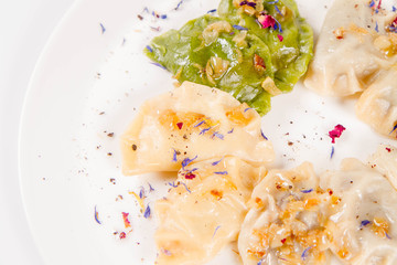 Dumplings with different kinds of stuffing decorated on a plate