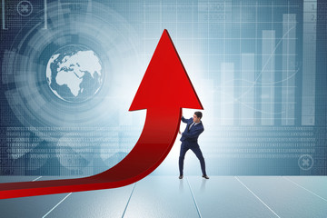 Businessman supporting growtn in economy on chart graph
