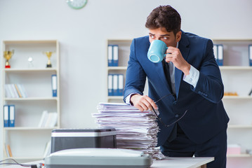 Businessman making copies in copying machine