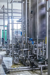 Industrial stainless steel pipeline connected with vats and control valves 