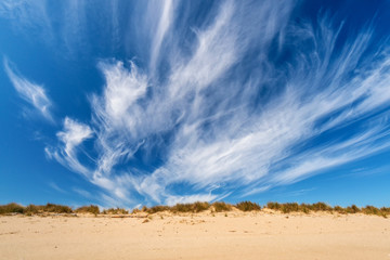 Seascape with dramatic blue sky and clouds