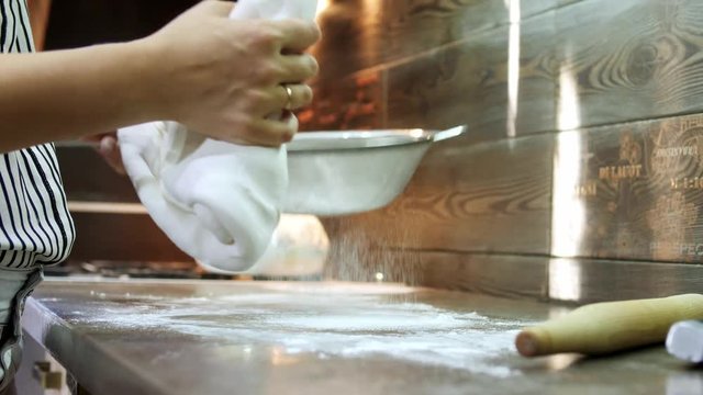Woman's hands knead sugar mastic for making dessert
