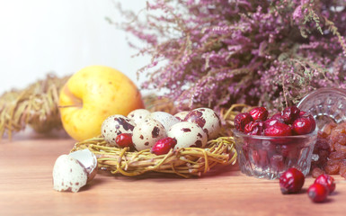 spring composition, nest with eggs near the bunch of heather, Easter.