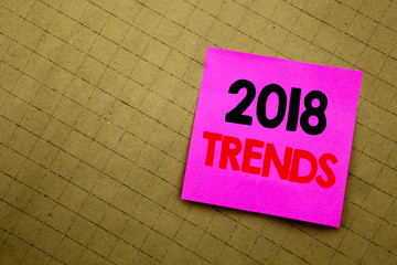 Handwritten text caption showing 2018 Trends. Business concept writing for Trending Data Prediction written on sticky note paper on the yellow background.