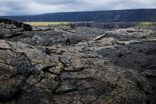 the volcanic wasteland of old lava fields on the big island of hawaii in the pacific ocean showing the landscape of volcano national park