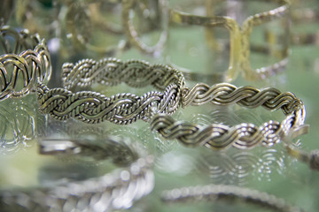 A display of silver bracelets in a mexican jewelry store