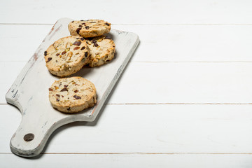 Homemade sweet cookies isolated on white wooden background with copy text.