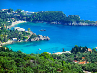 Fototapeta na wymiar Heart-shaped bay, romantic, Paleokastrica beach on Corfu Kerkyra, Greece. Ionian sea. Bay with crystal clear azur water.