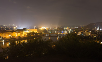 Fototapeta na wymiar Bridges in Prague at night. View from the Leten gardens. Prague, Czech Republic