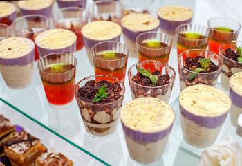 Assorted desserts on glass. Concept party, wedding, restaurant, catering, dessert.