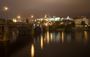 Fototapeta na wymiar Charles Bridge and Prague Castle at night, in the autumn. Prague, Czech Republic