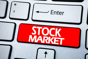 Handwriting Announcement text showing Stock Market. Business concept for Equity Share Exchange written on red key on the keybord background.