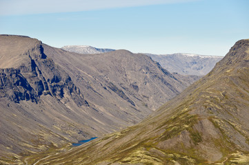 View of Khibiny Mountains located behind the Polar Circle, Kola Peninsula, Murmansk region, Russia. Vudyavriok Valley. Shot from the mountain Kukisvumchorr