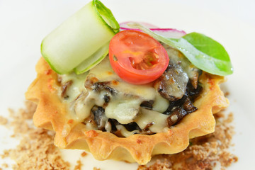 Holiday appetizer: tartlets with mushrooms and vegetables