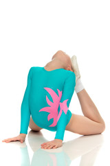 Young girl acrobat perform exercises.