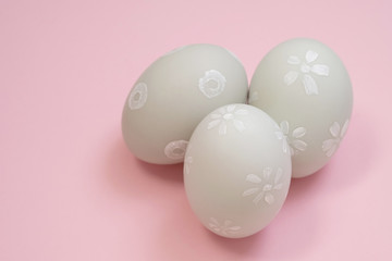 handmade easter eggs isolated on a pink background.