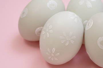 handmade easter eggs isolated on a pink background.