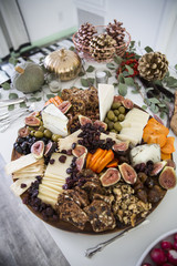 A decadent cheeseboard on a holiday table