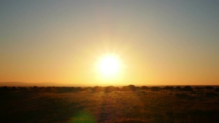 Bright Sun over Field Time Lapse