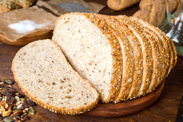 Seed bread slices, rustic wooden stage