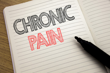 Handwriting Announcement text showing Chronic Pain. Business concept for Feeling Bad ill Care written on notebook with copy space on book background with marker pen