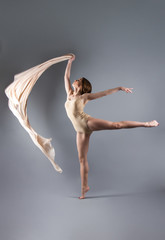 beautiful young girl dancing with cloth. Flying fluttering fabric.