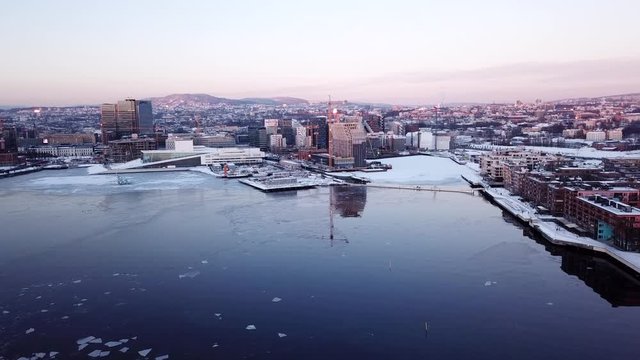 Aerial approaching shot at sunset of the new Munch museum Lambda in Oslo, Norway seen from fjord towards Grefsenkollen