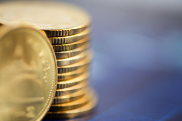 Stack of coins with Finance  graph background.