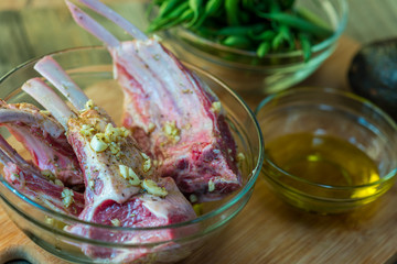 Marinating lamp chops and green beans closeup
