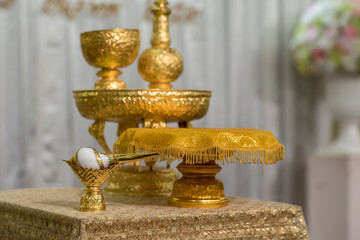 Thai wedding set of gold tray of ceremonial water pouring conch shell for traditional wedding in thailand.