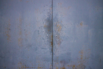 Iron gate blue. Garage. Peel-off paint.