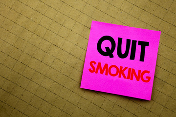Handwritten text caption showing Quit Smoking. Business concept writing for Stop for Cigarette  written on sticky note paper on the yellow background.