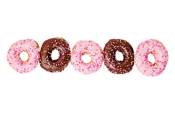 Colorful donuts in a row. pink and chocolate donuts alternate. flat lay, top view. Isolated on white background.