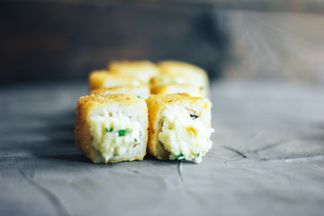 Fried sushi roll with shrimp and caviar. top view