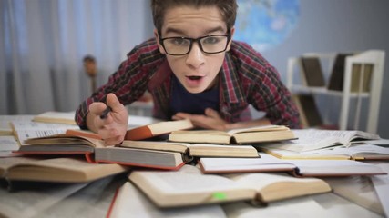Whizzkid studying encyclopedia, learning new information, thirst for knowledge