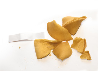 Broken fortune cookie with blank paper strip