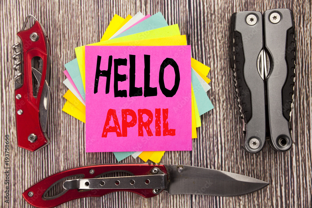 Poster writing text showing hello april. business concept for spring welcome written on sticky note wooden 