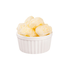Sweet yellow corn sticks with powdered sugar in white ceramics bowl isolated on white background. Fast food template for menu, advertising, cover.